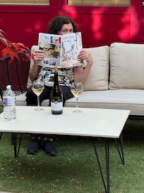 My wife enjoying a bottle of wine on the back courtyard on her birthday.