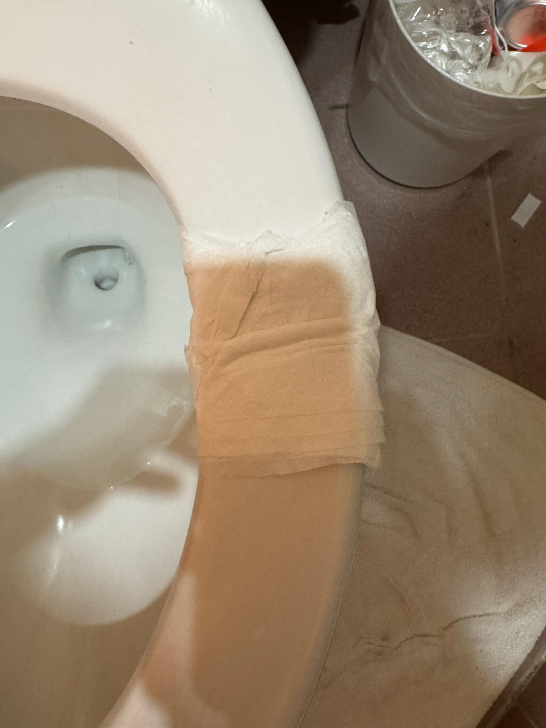 broken toilet seat that had to be wrapped