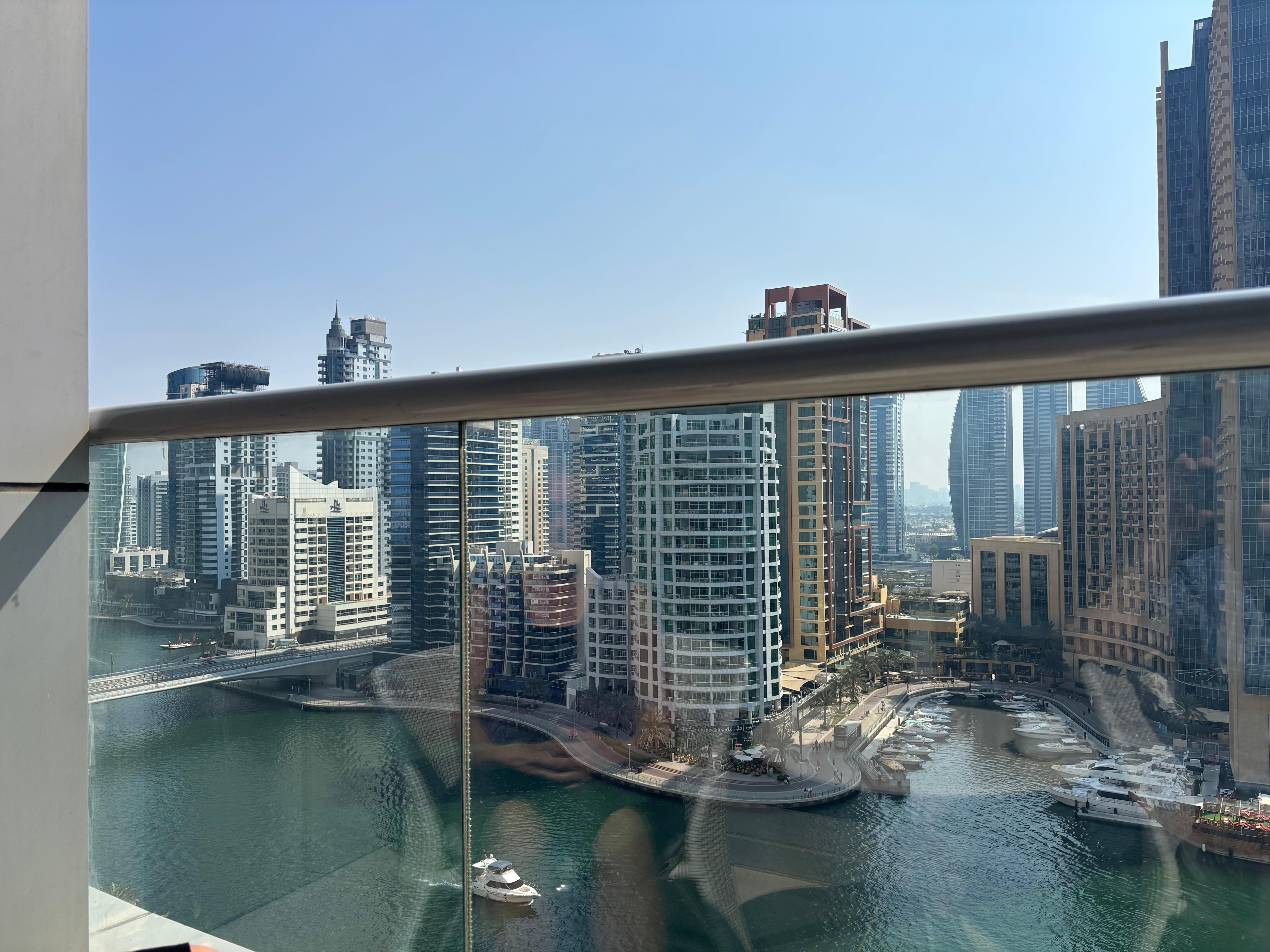 Room with balcony and marina view