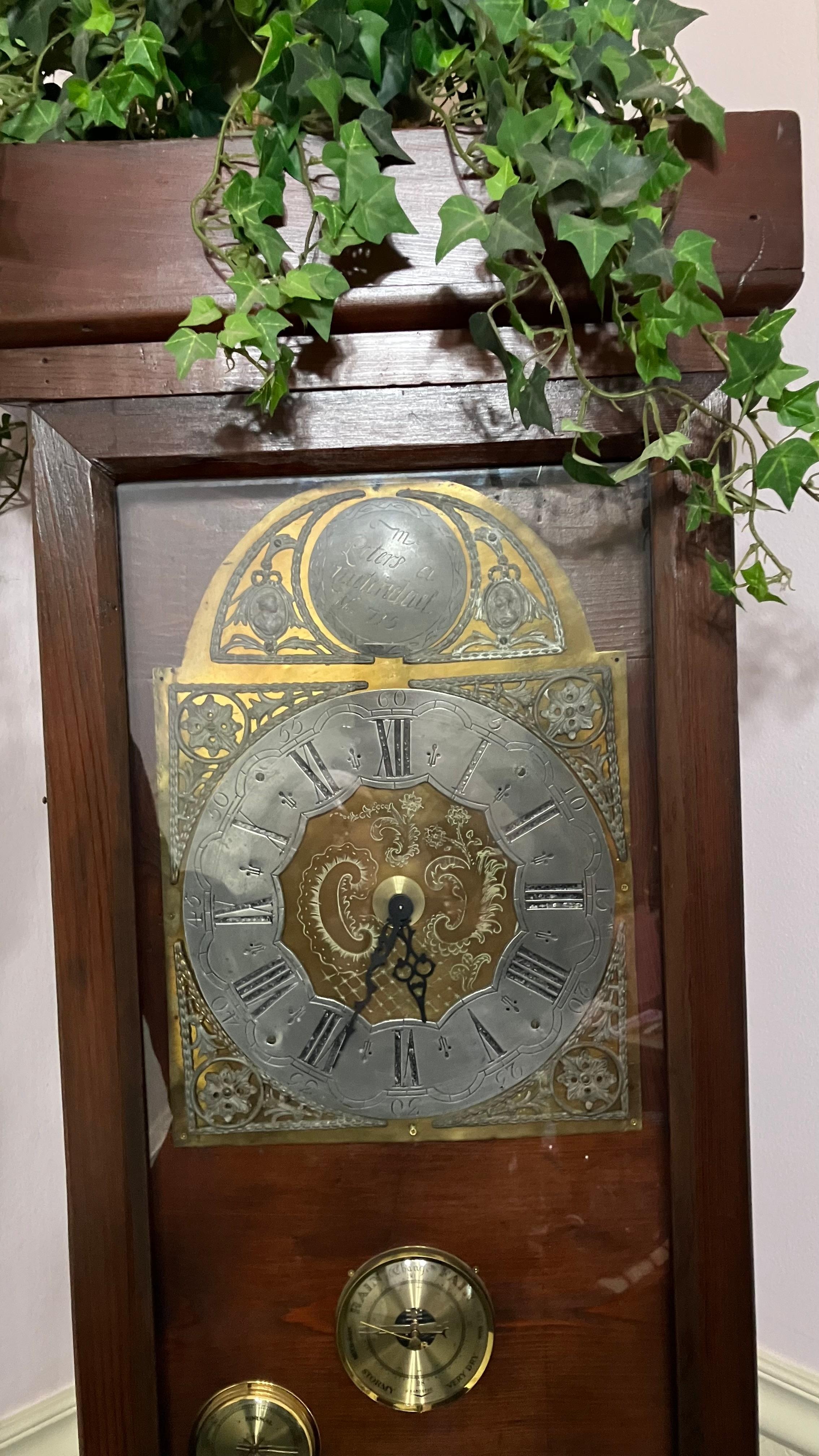 Grandfather clock in the entryway.