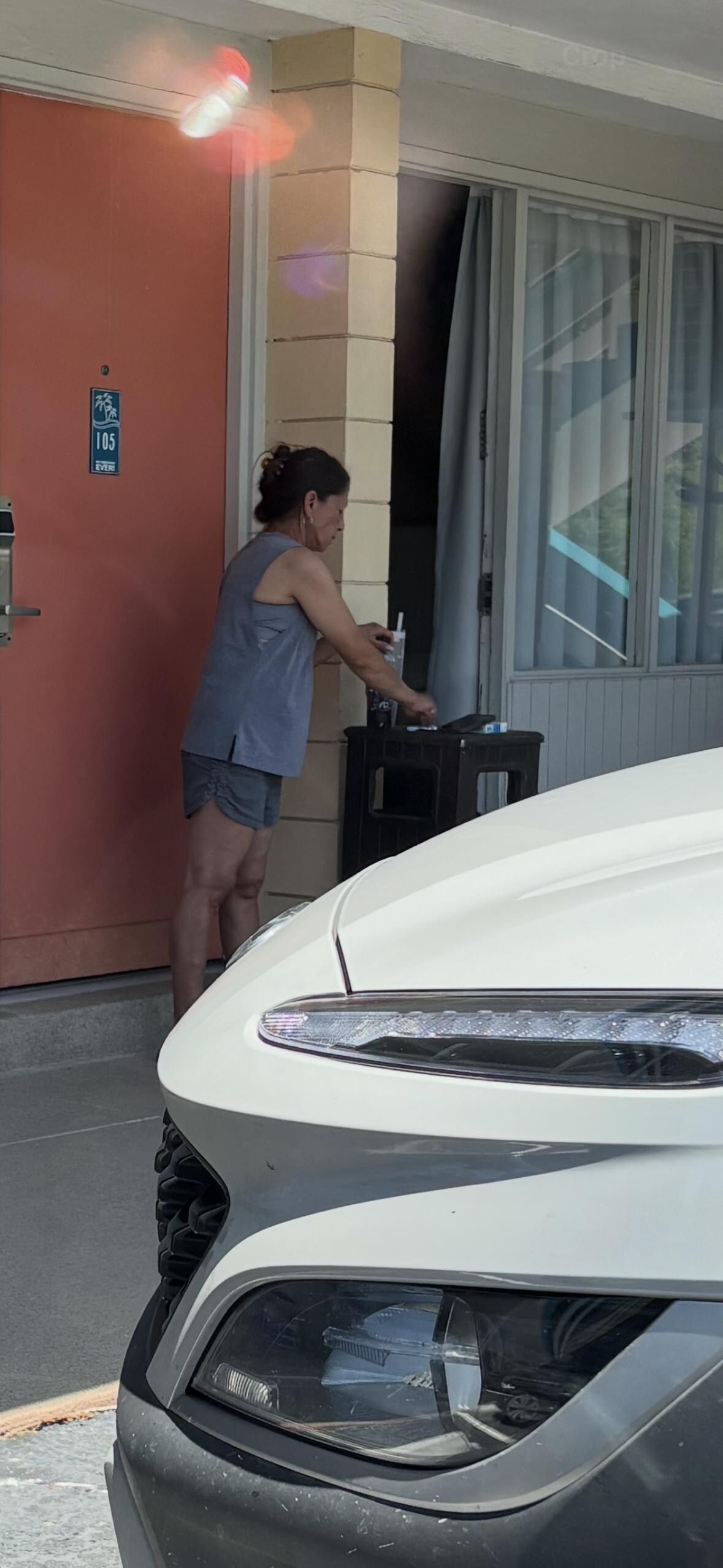 Woman smoking out front of our door