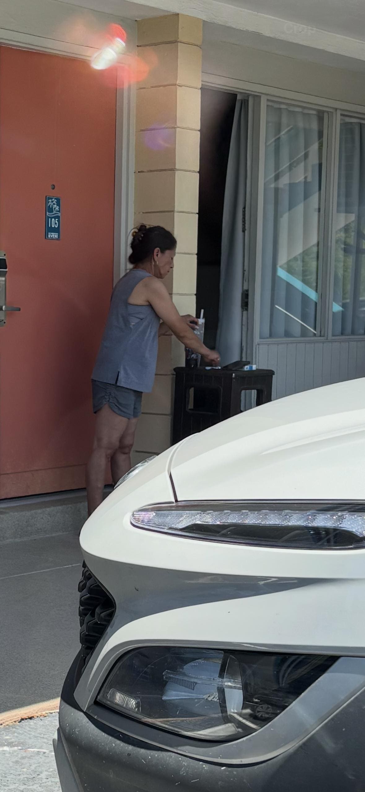 Woman smoking out front of our door