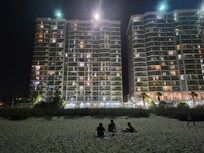 View of the condo from the Ocean at night! 👍👍Georgous at night lit up!