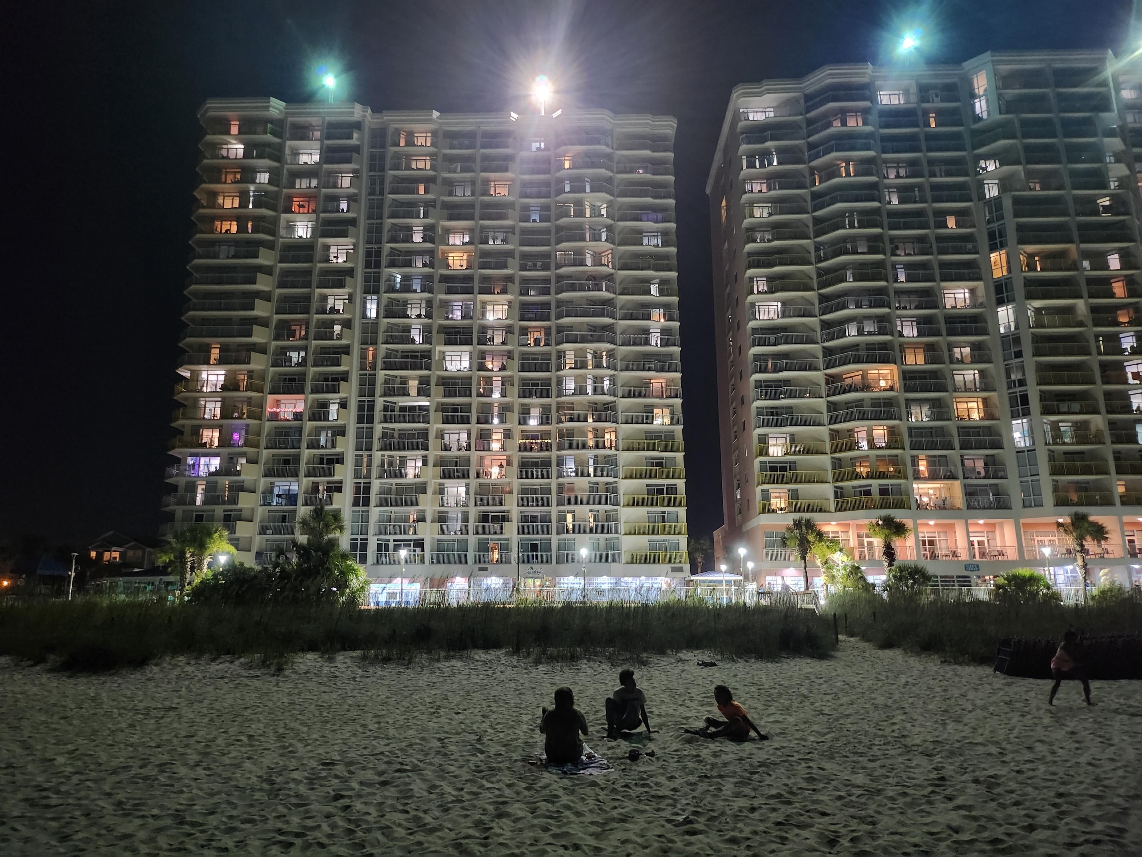 View of the condo from the Ocean at night! 👍👍Georgous at night lit up!