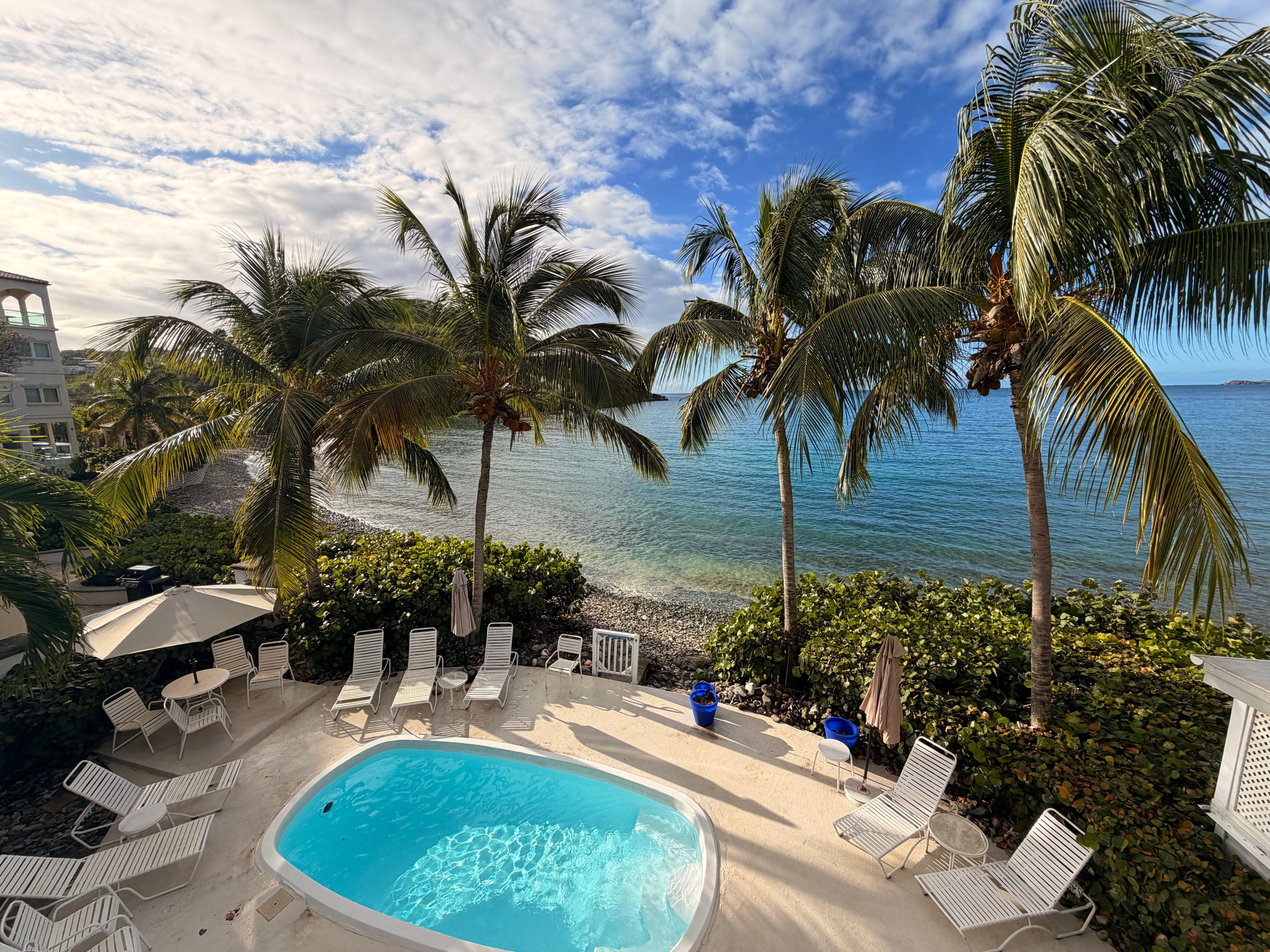View from our Beauganvilla room patio over looking the pool and the bay. 