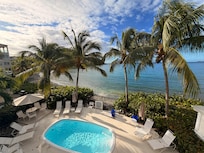 View from our Beauganvilla room patio over looking the pool and the bay.