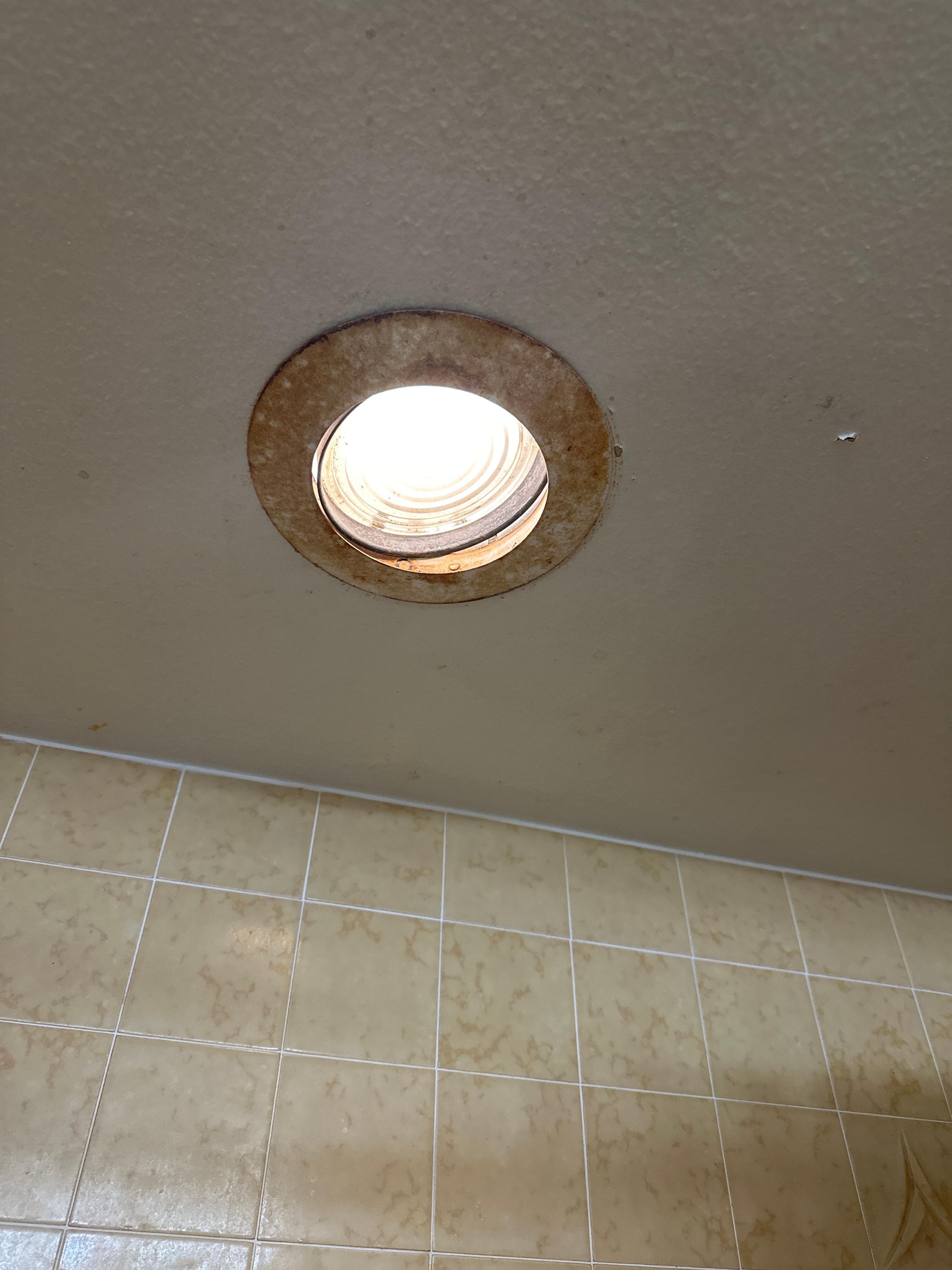 Light not properly secure above shower