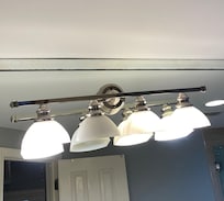 Light fixture uneven with burned out bulb