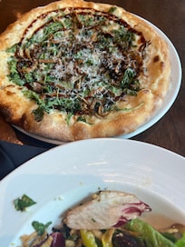 Pizza and salad from restaurant inside hotel