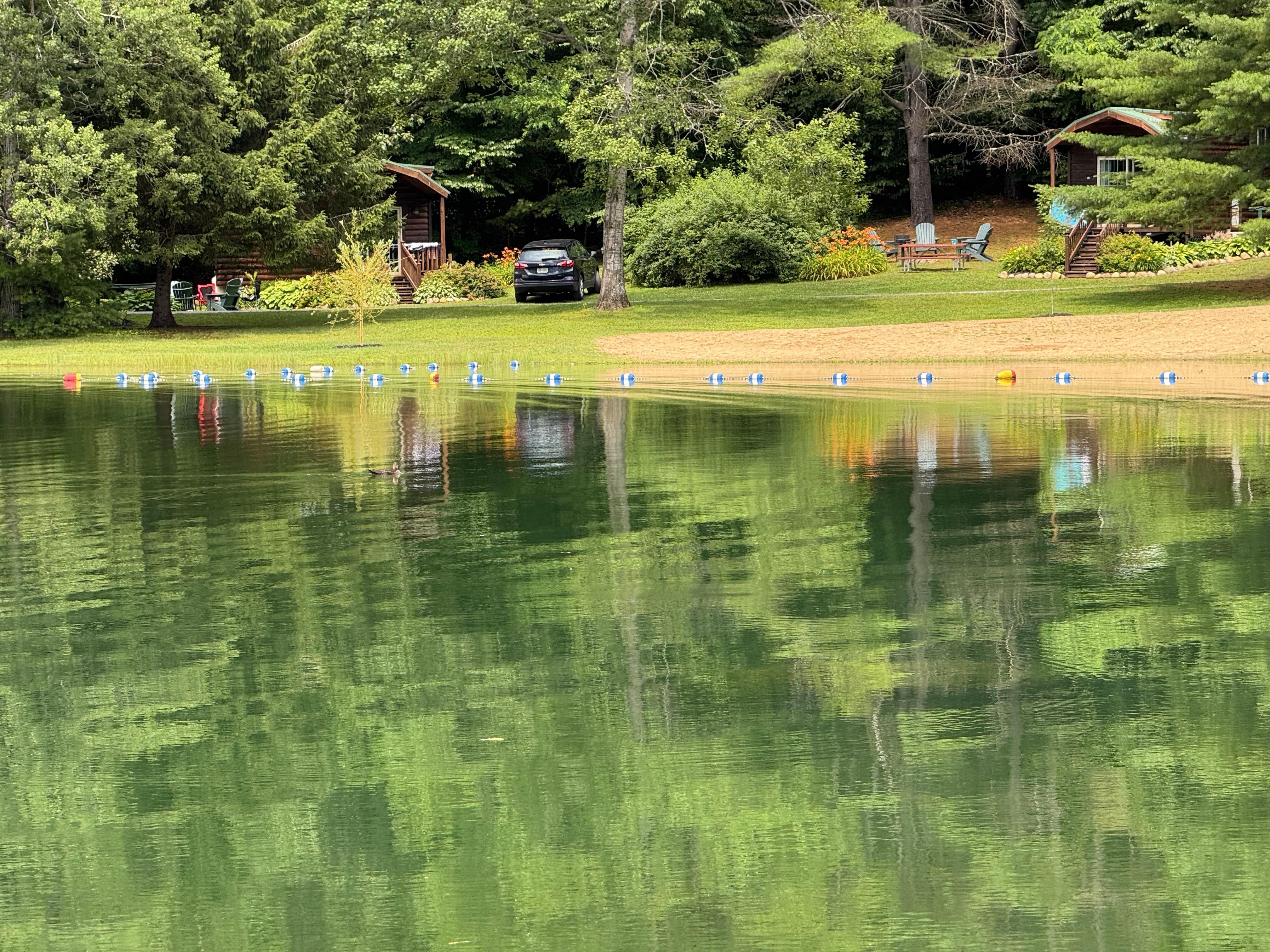 View from across the pond. Our cabin was the one to the right. 