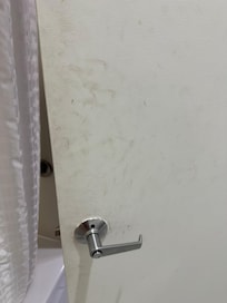 Brown stains all over the door.