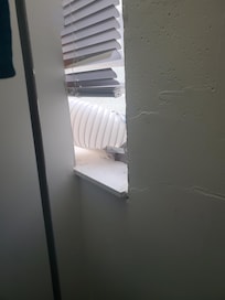 two rooms shared one small window - wall was built up to window