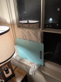 Broken window with temporary repair