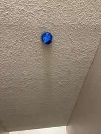 Taped over sprinkler in stairwell