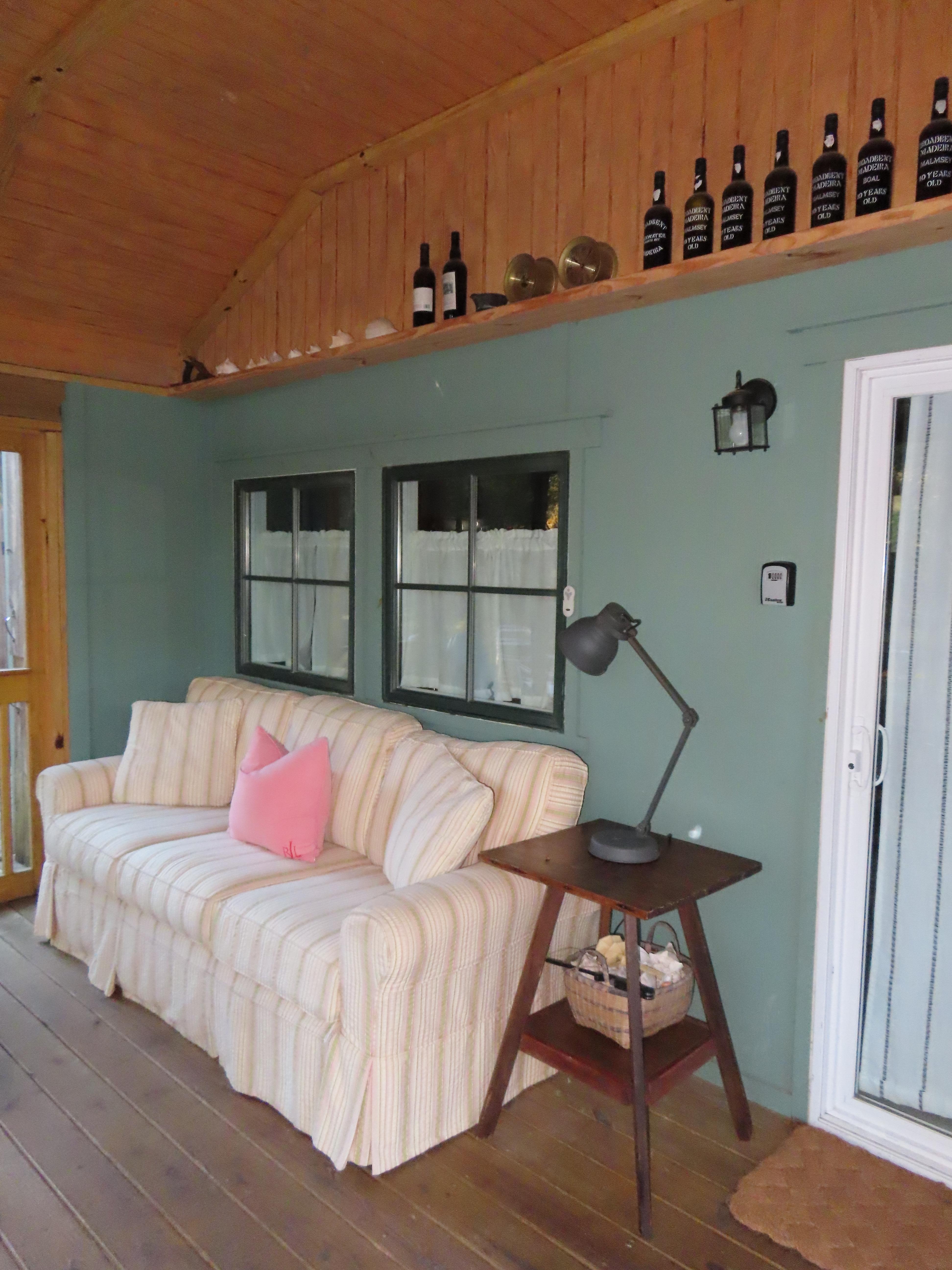 Super comfortable couch on enclosed patio. 