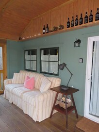 Super comfortable couch on enclosed patio.