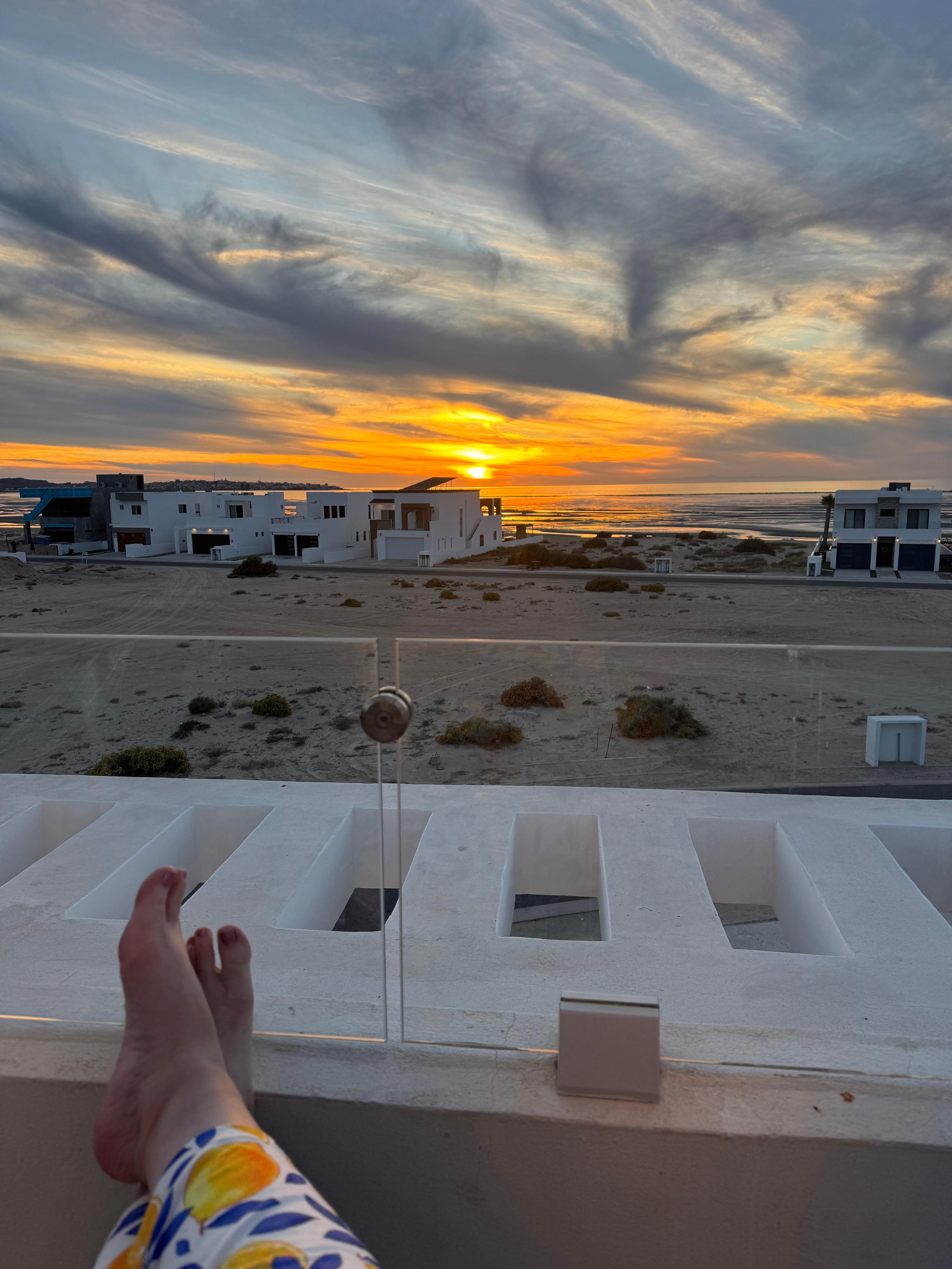View towards beach/sunset from rooftop deck.