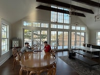 Our boys enjoying a game of chess in the kitchen.