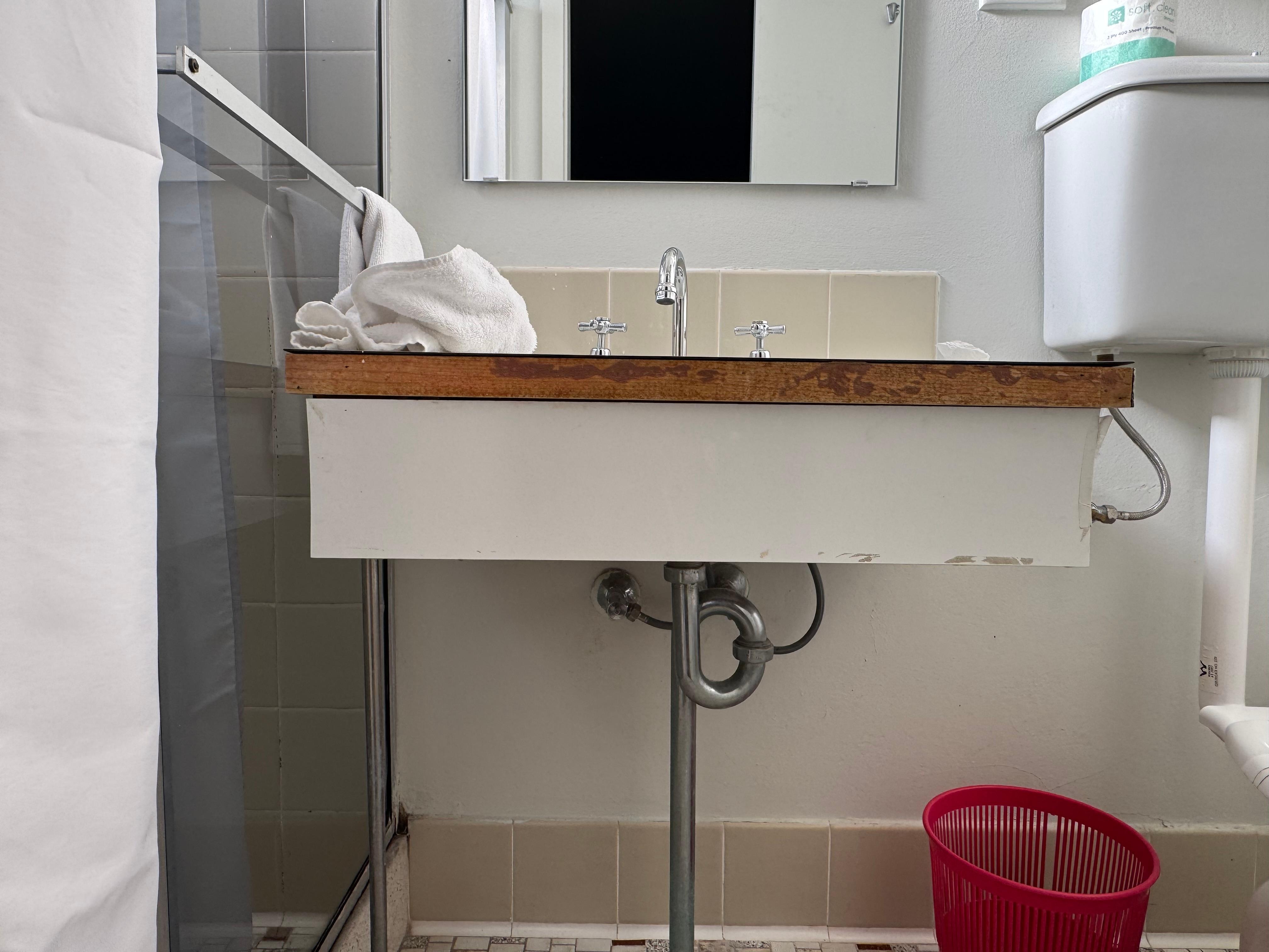 Vanity edging missing and damaged. 