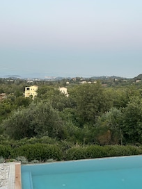 View from the veranda across the landscape to the sea, with the pool just below.