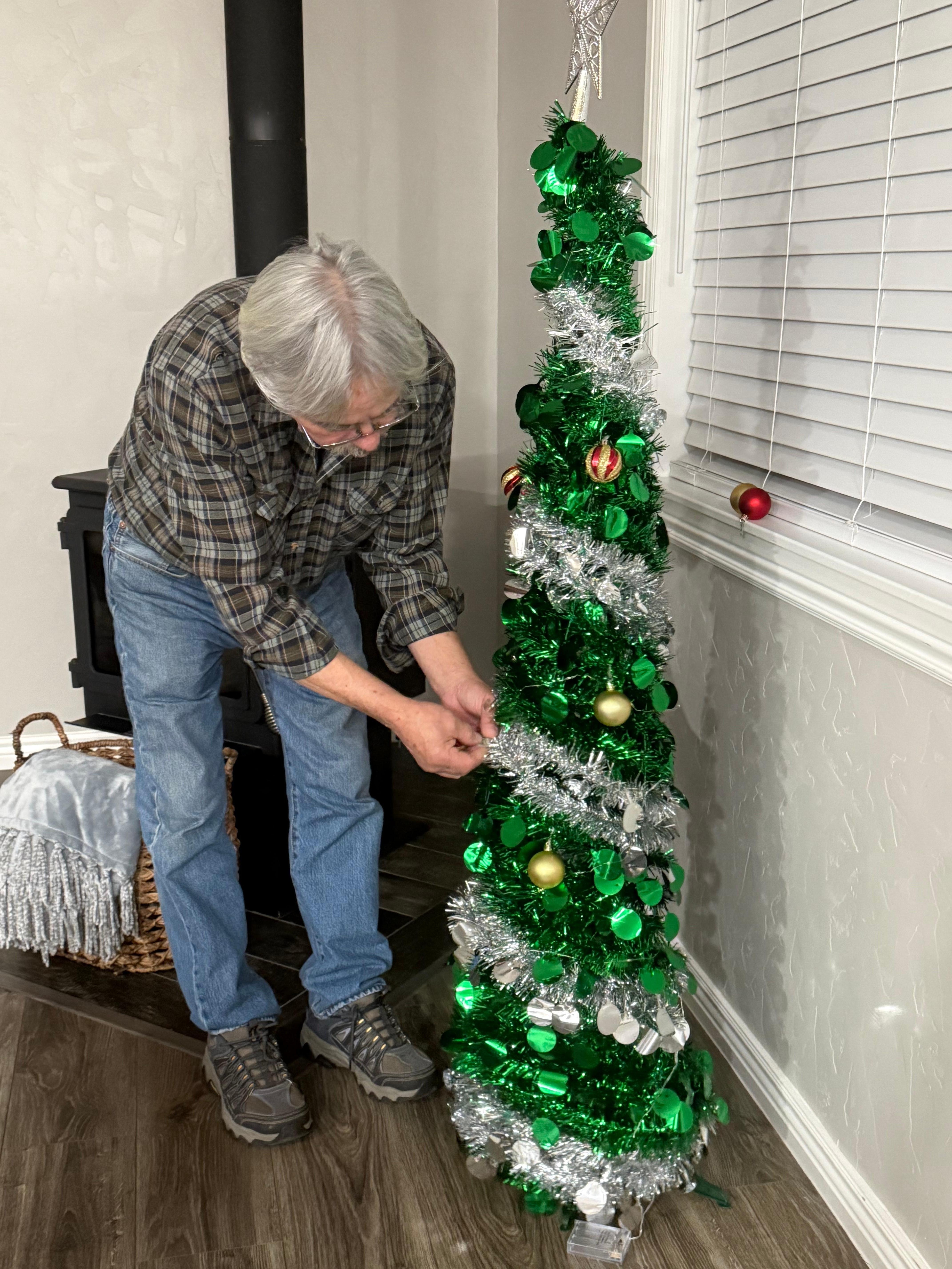 Larry decorating our portable Christmas tree