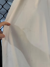 One of many stains on the curtain - Right side - Sitting area. Sheer curtains are the same.