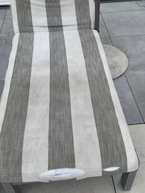 Stained and torn pool chaise