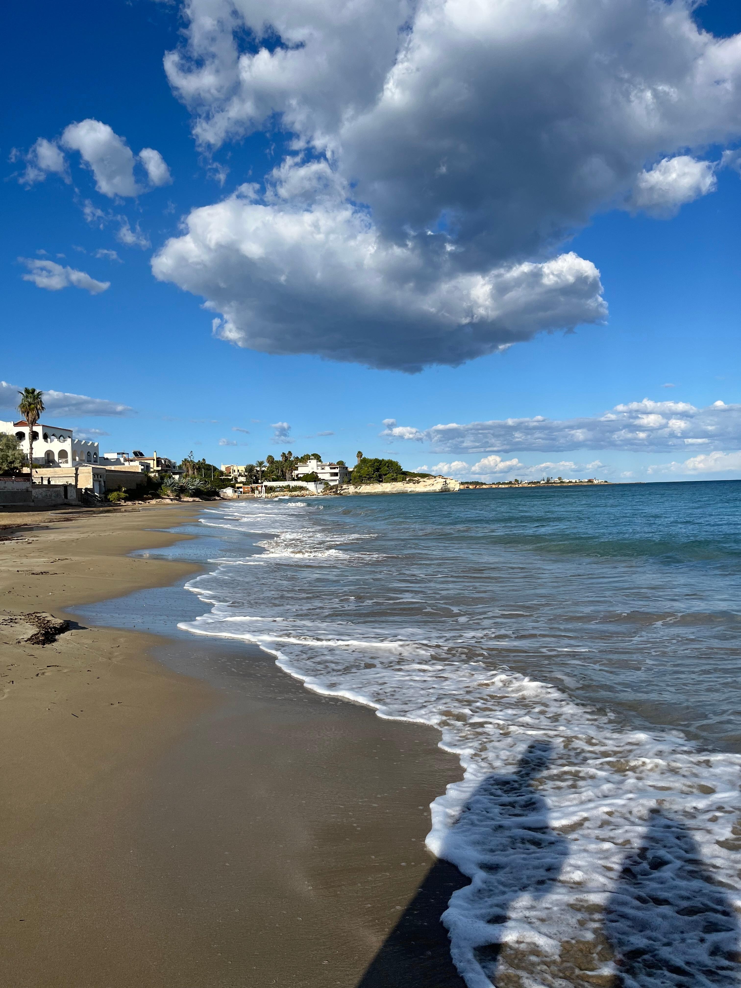 The beach just steps away from the unit through a private gate.