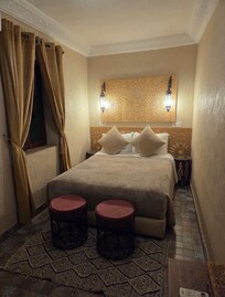 Une des chambres, ambiance chaleureuse