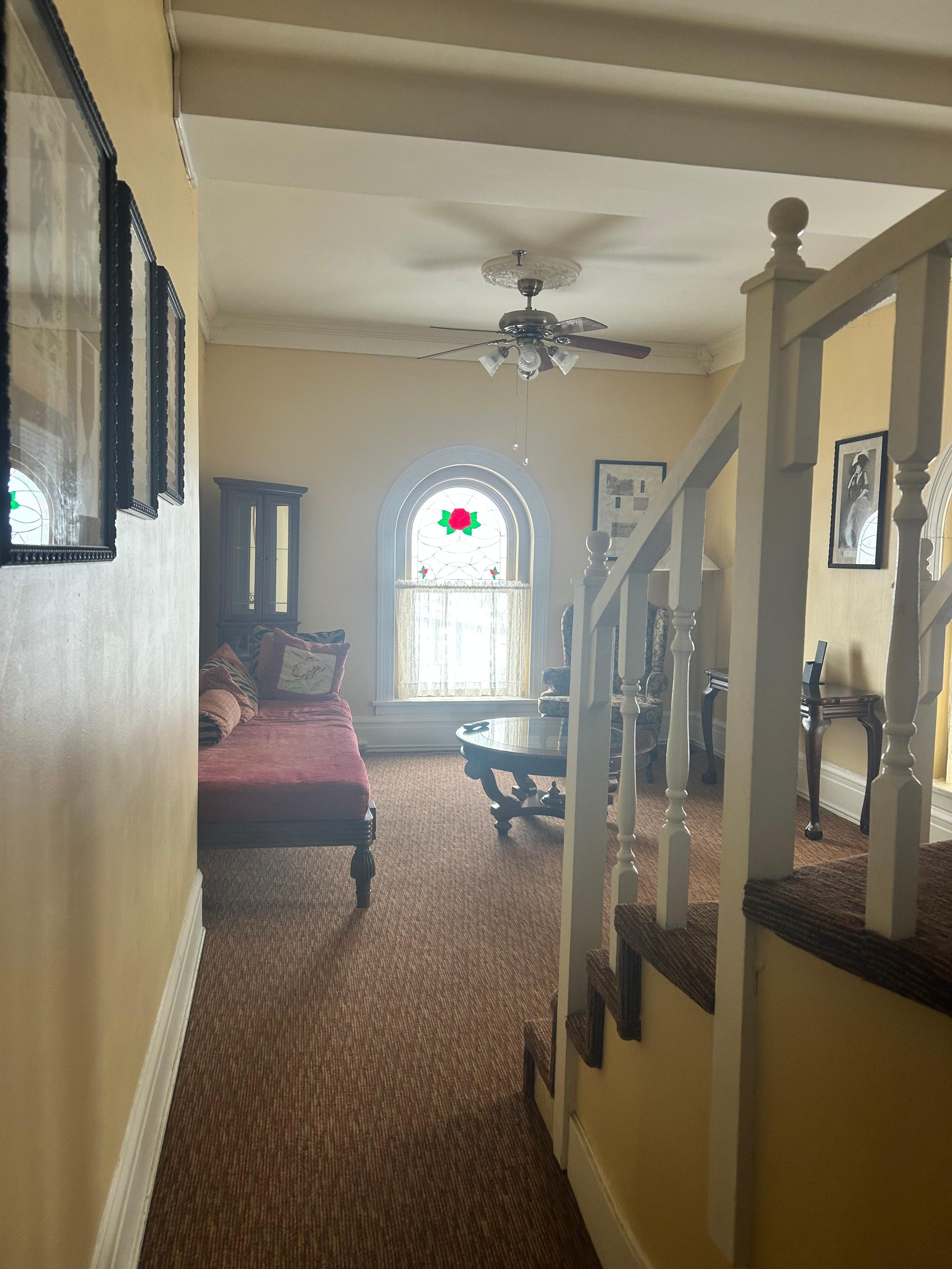 Inside the suite - sitting/tv room with the steps up to the roof