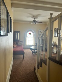 Inside the suite - sitting/tv room with the steps up to the roof