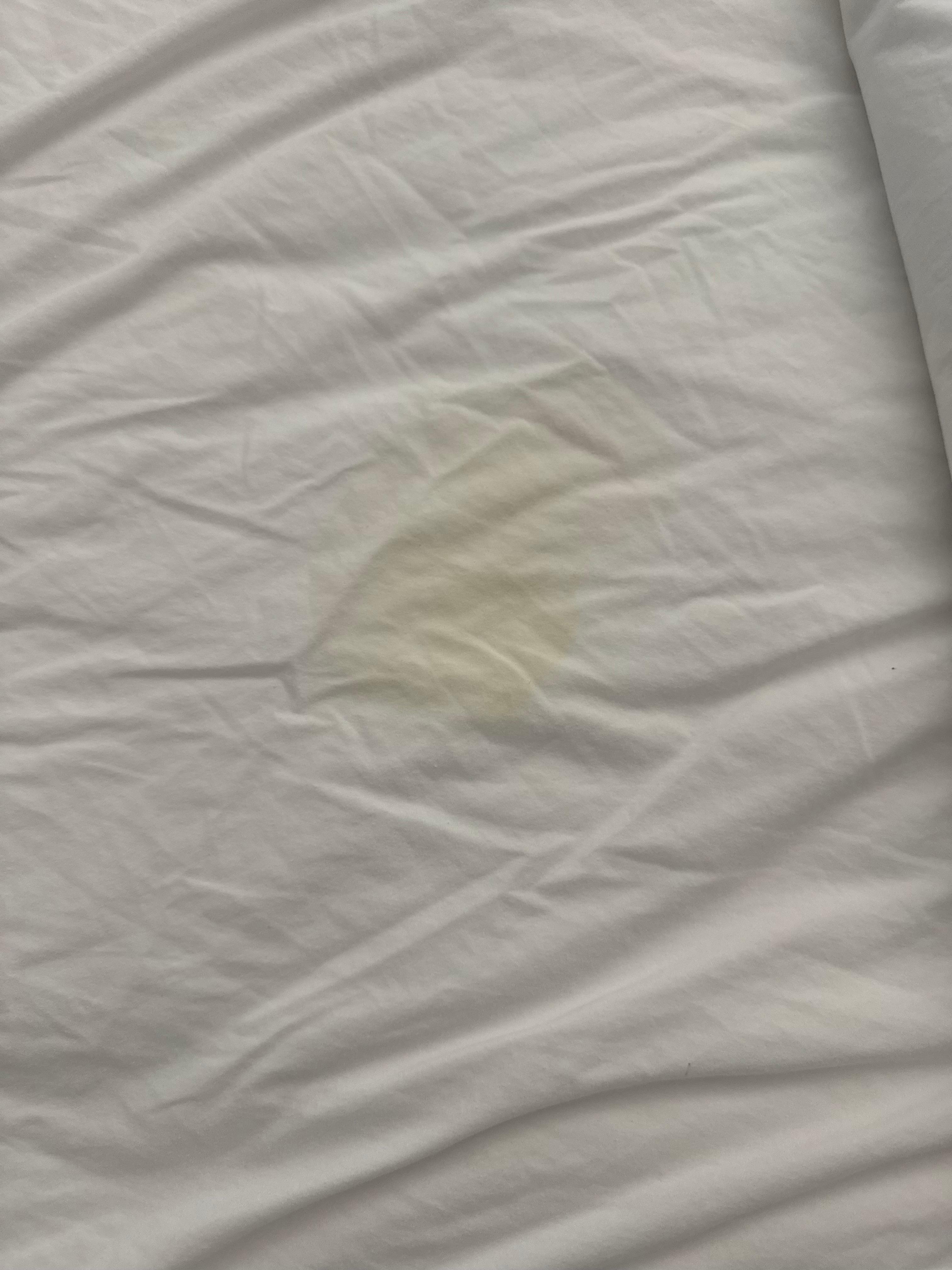 Yellowish stain on the bed that had not been changed!