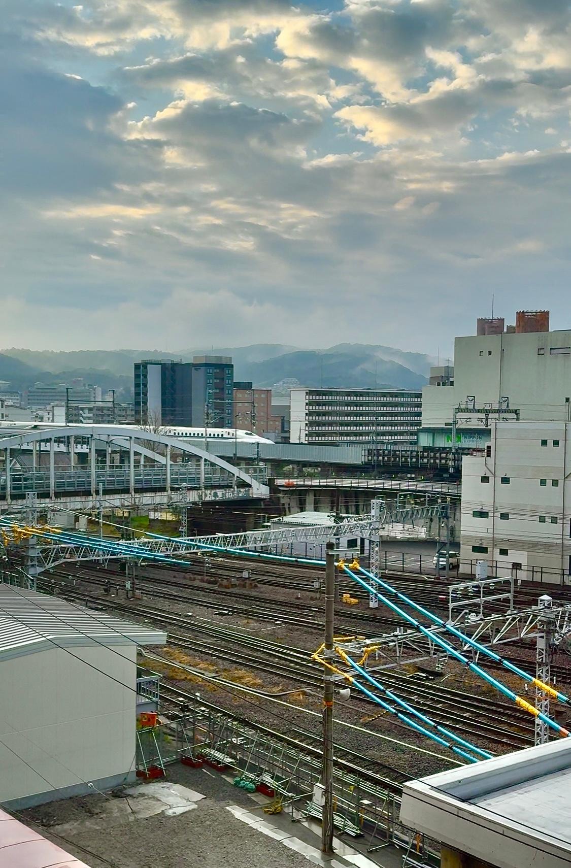 View of Kyoto Station tracks, and Shinkansen, snapped at 5:45AM, from the Kyoto Century hotel. 