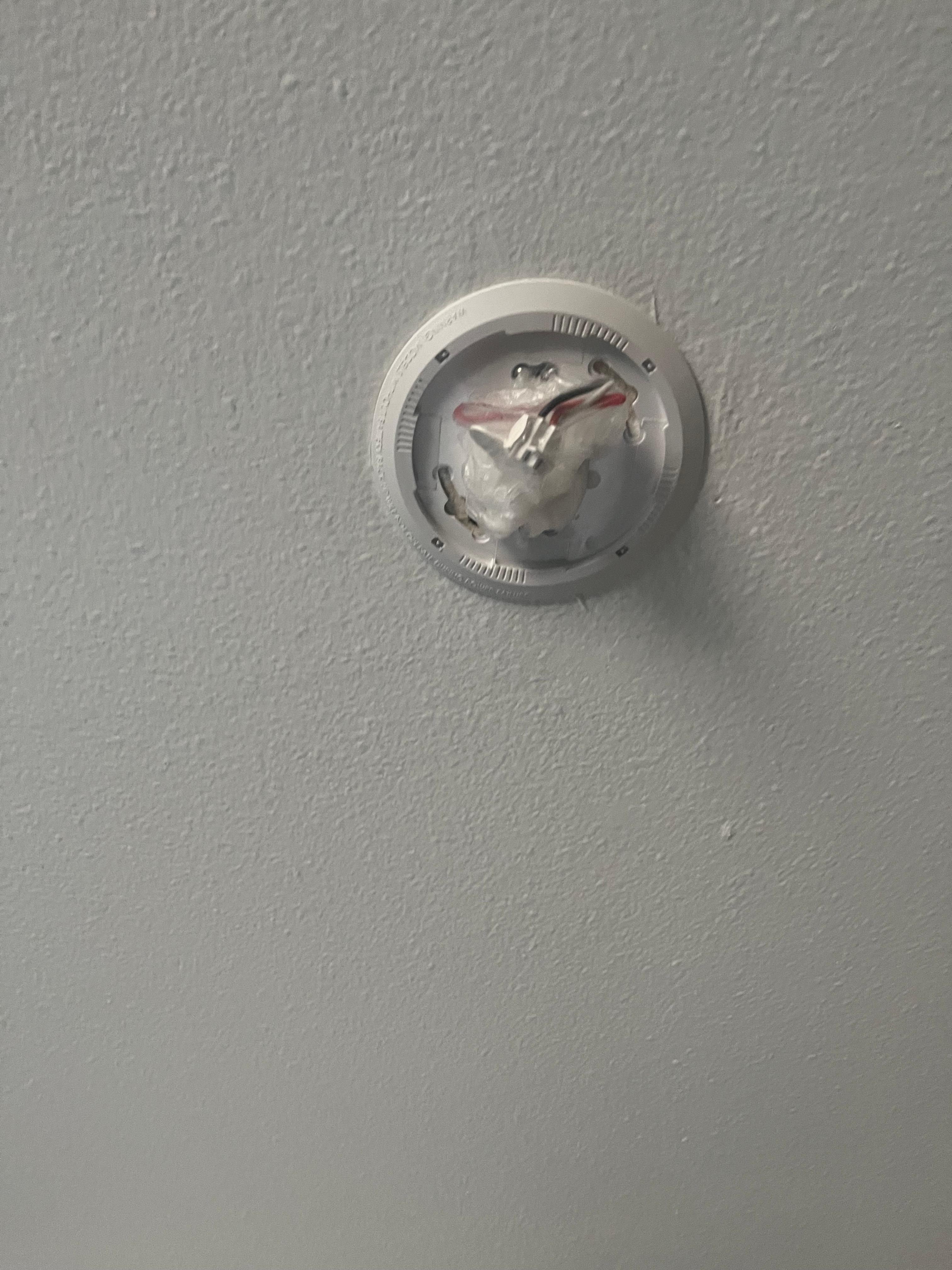 Smoke Detector wiring cut and wrapped in plastic and NOT attached to actual Detector piece. 