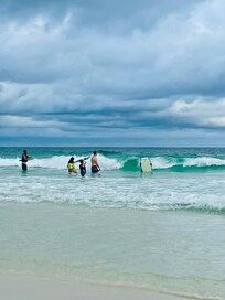 Fun on the beach, catching sun, sand, and waves.