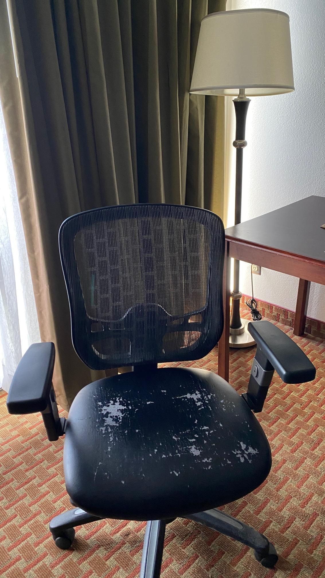 Peeling chair. Can't see stains on lampshade.