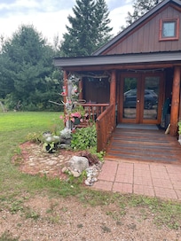 Front of cabin and hummingbird feeders