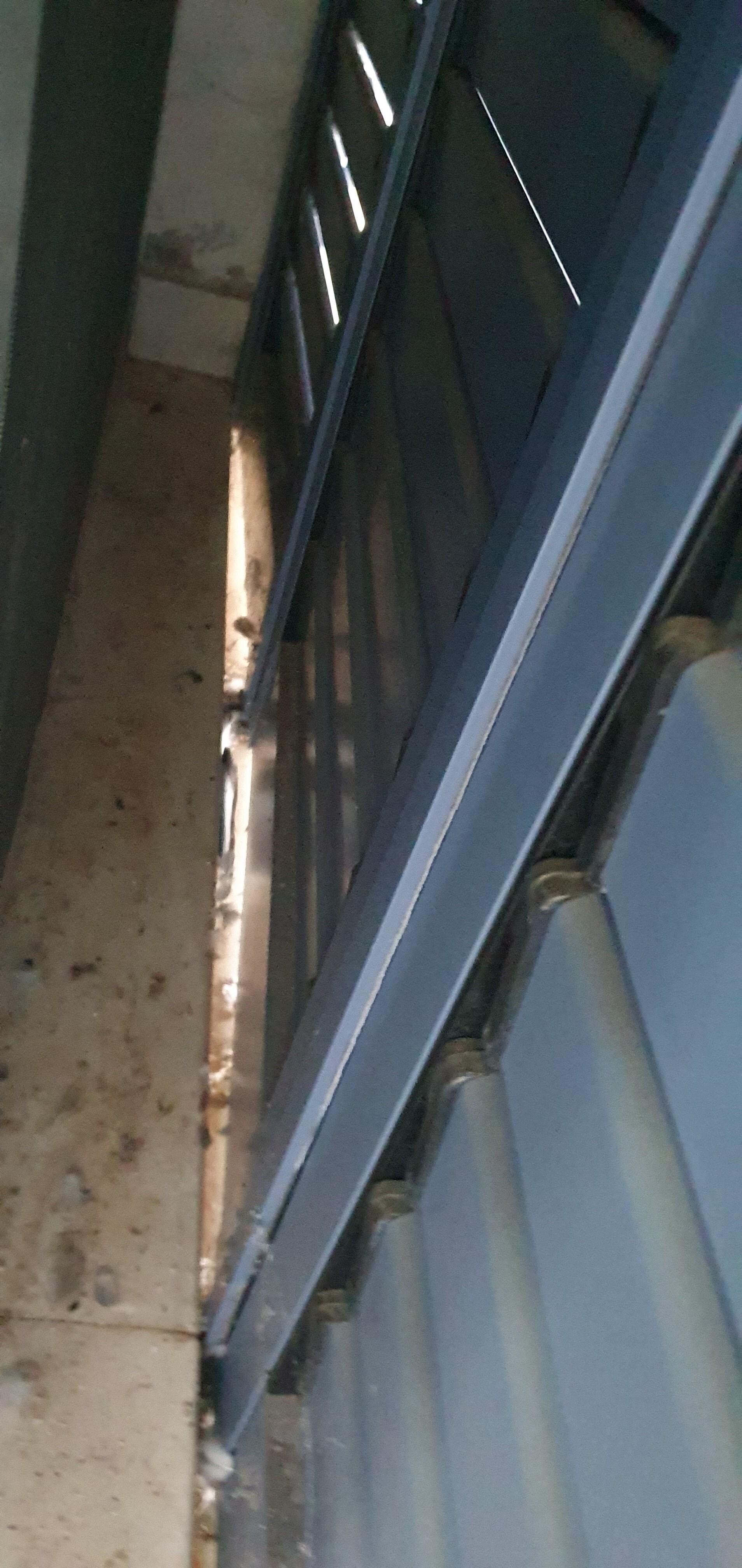 Pigeon debris behind patio shutters by bedroom door