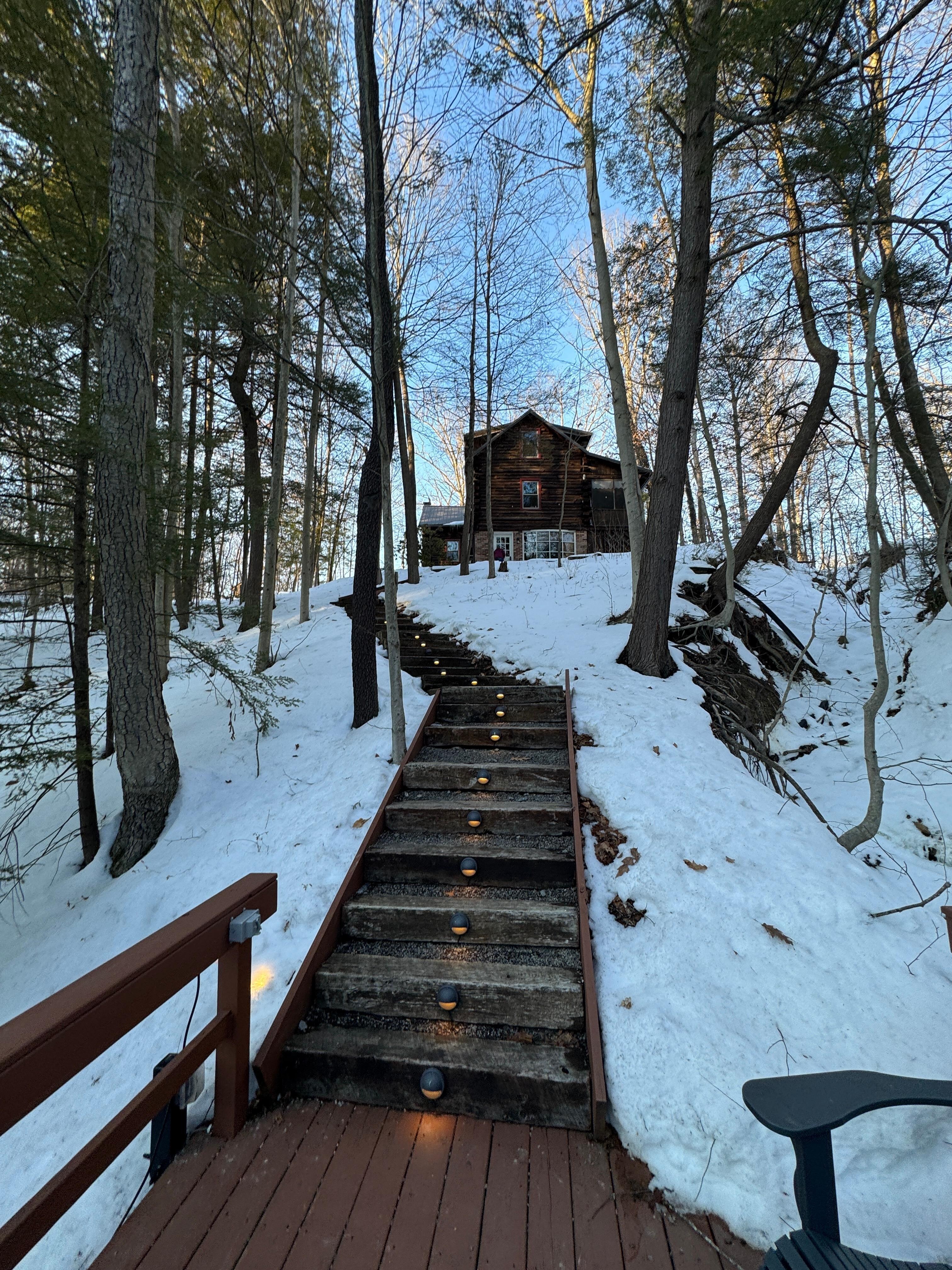 View up the lighted stairs to the cabin