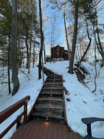 View up the lighted stairs to the cabin