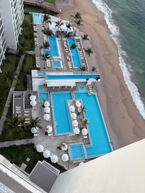 Daytime view of pools from the balcony