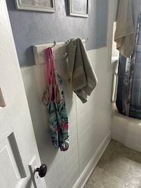 Used towel and swim suit in downstairs bathroom
