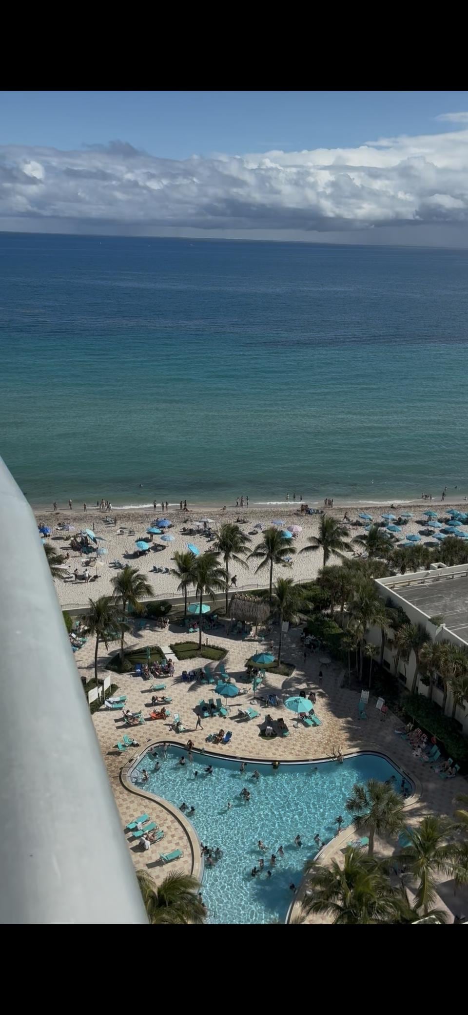 View of the pool and ocean from the balcony 