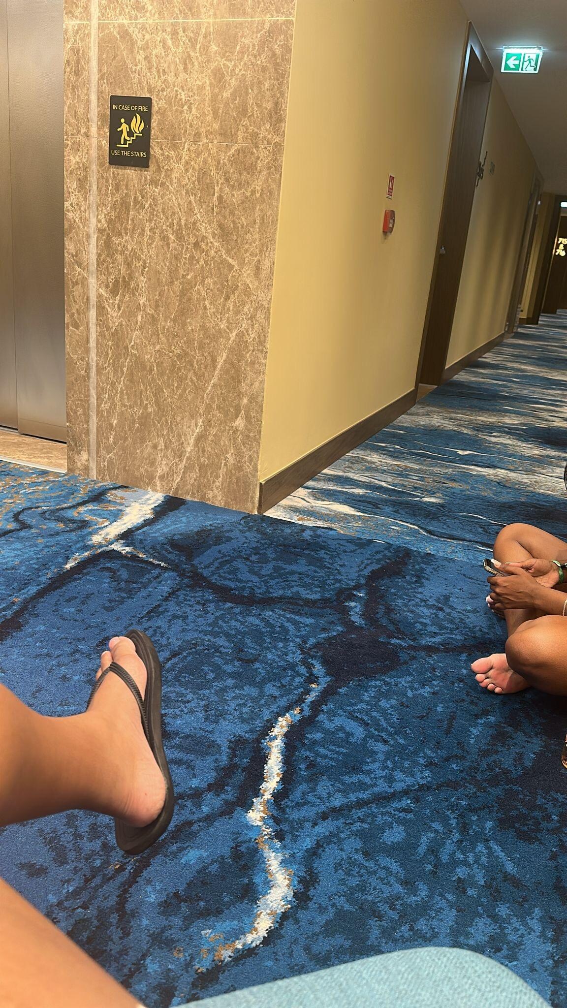 Sat out on the floor waiting for someone to come and open our room.