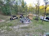 View from the deck overlooking the fire pit and extra lot.