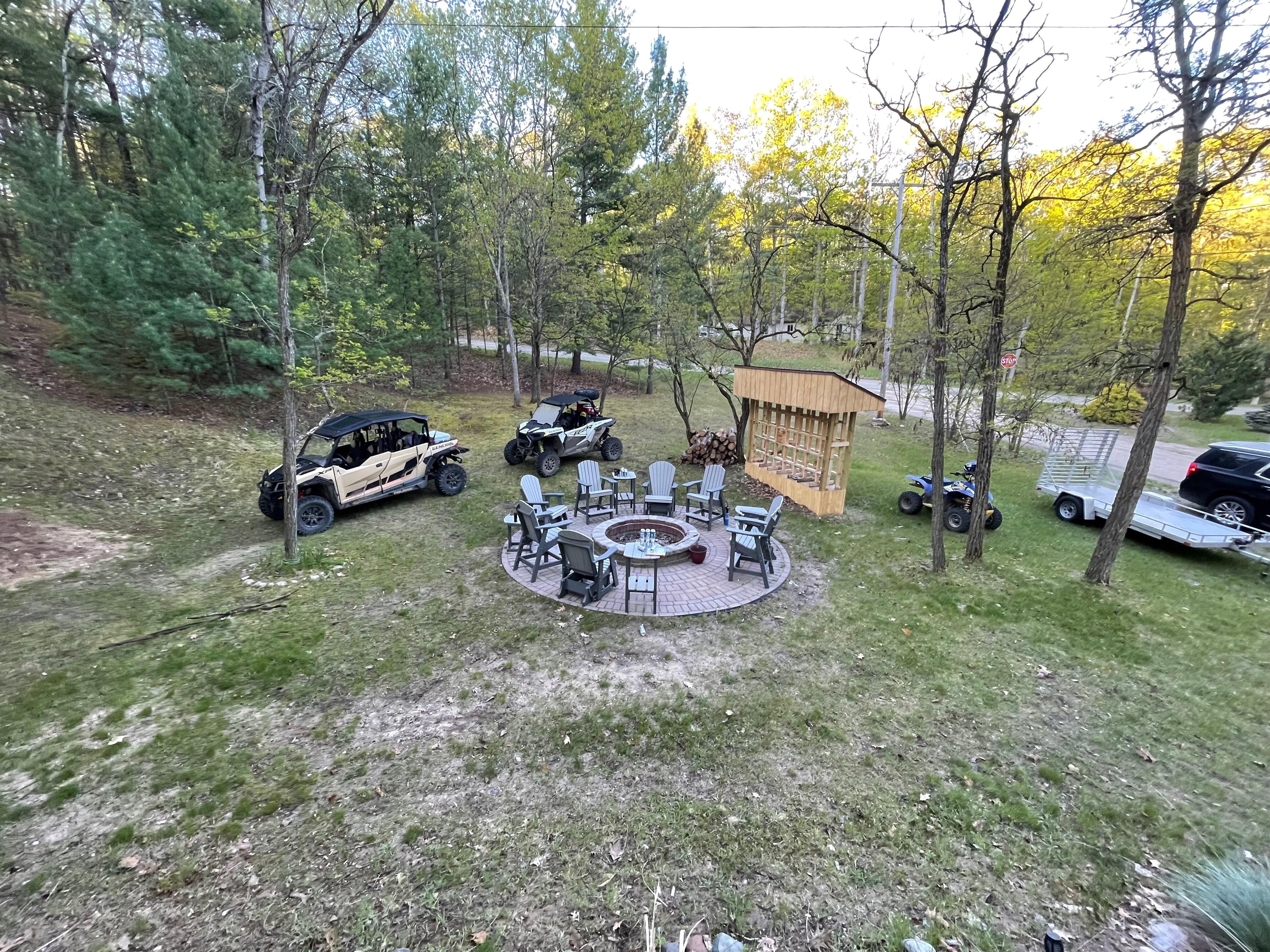 View from the deck overlooking the fire pit and extra lot. 
