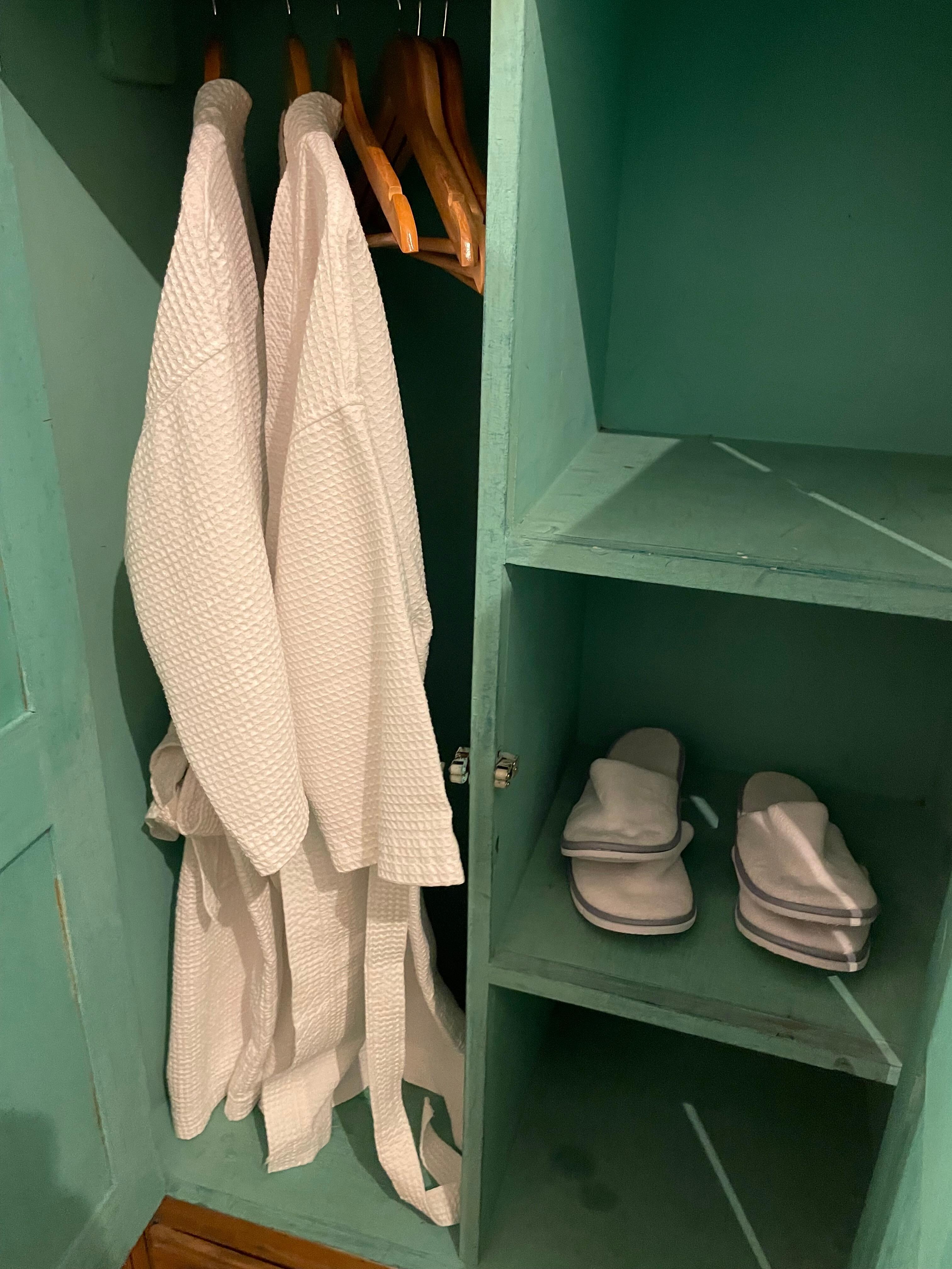 Amenities in each room include bathrodes and slippers
