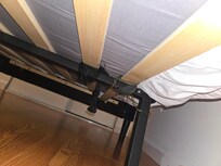 Broken bed help together with wire and a cloth strap.