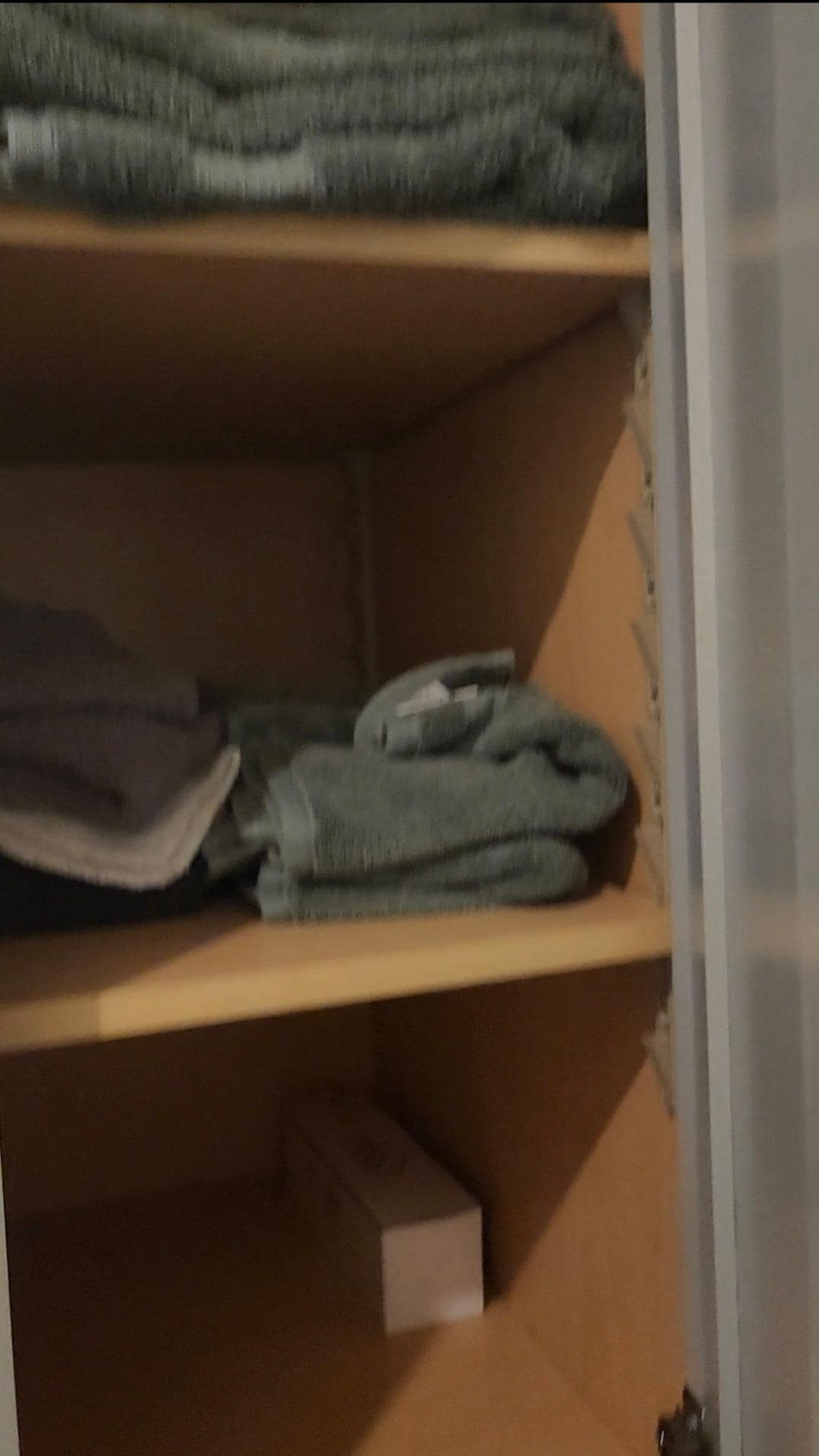 Main bedroom cabinets with towels. 