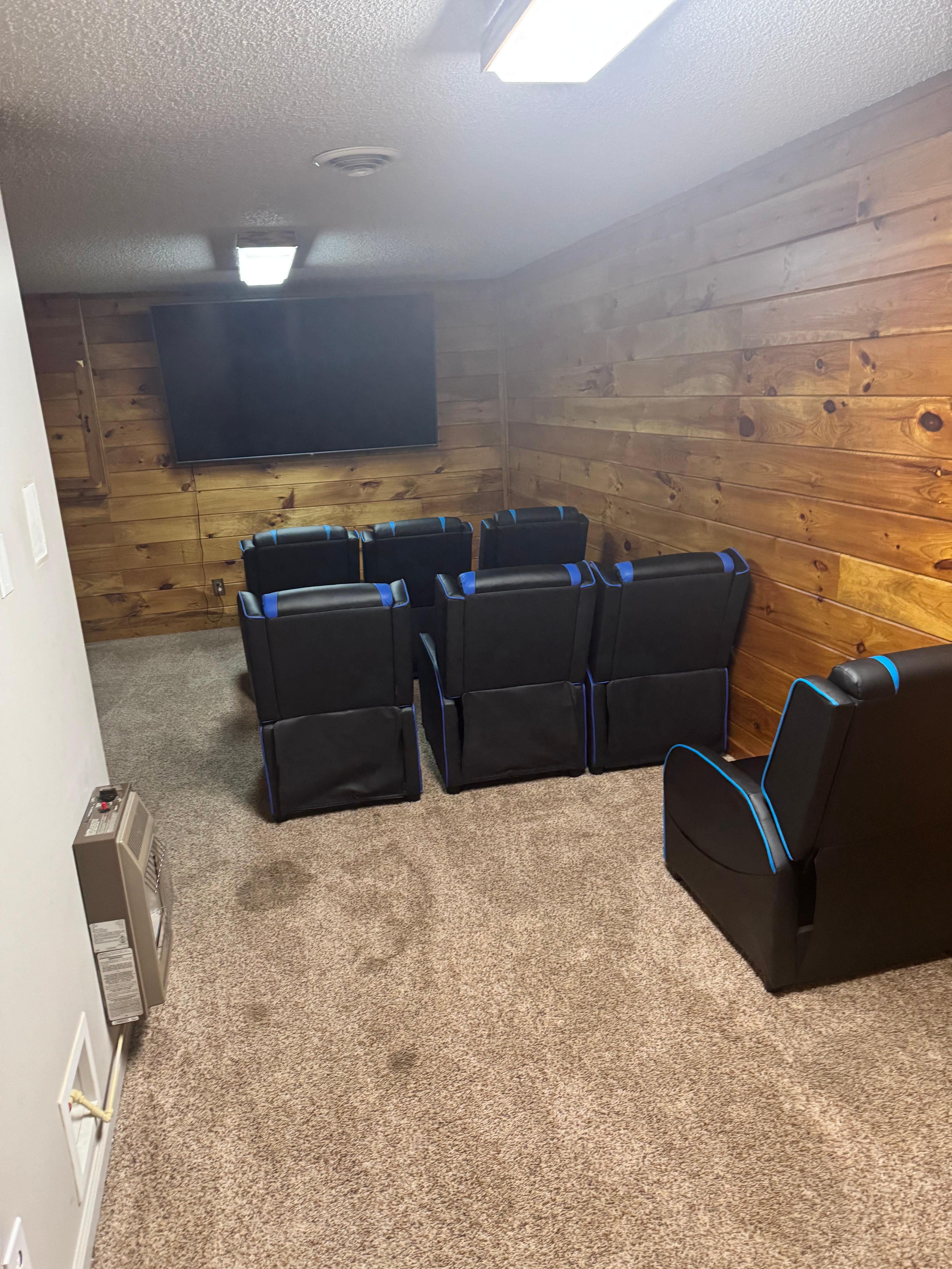 Theater room with seating for seven.  